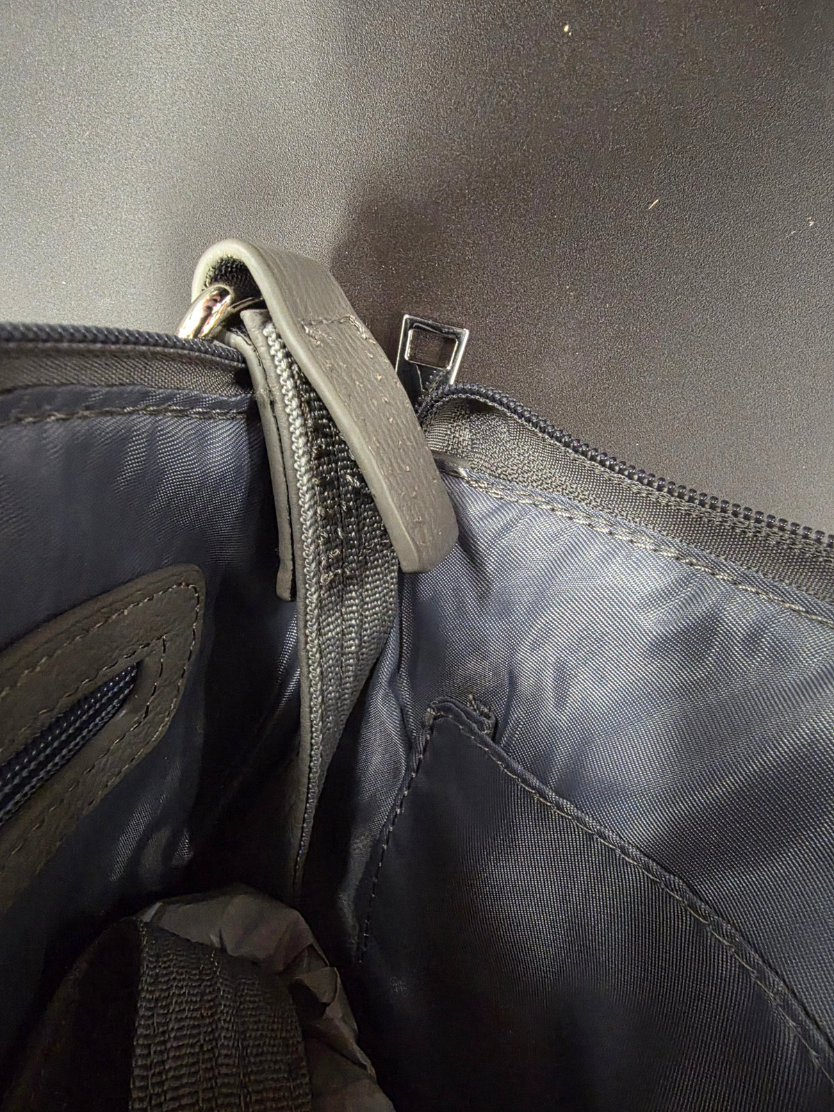 purse strap showing stitching has come undone