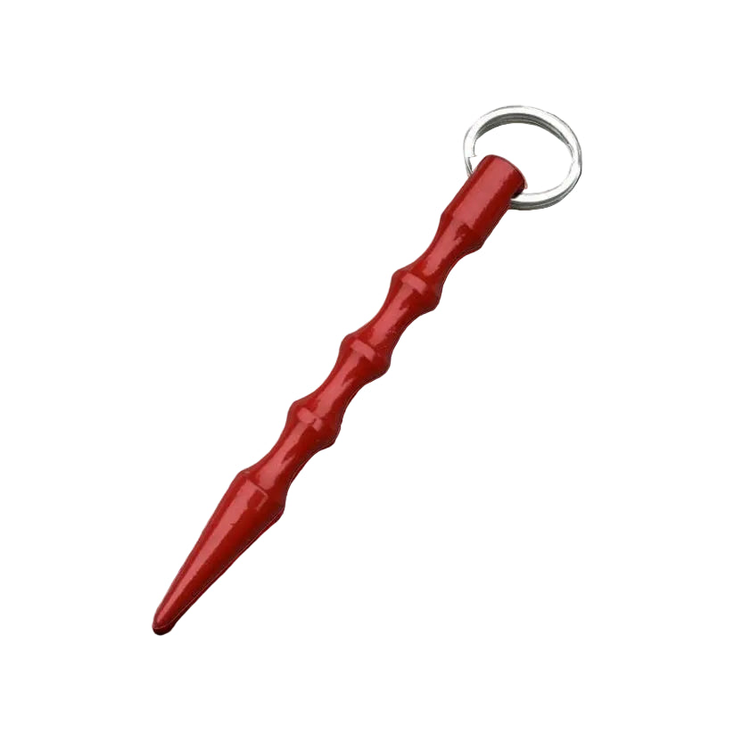 Red keychain with a metallic ring on a textured gray surface