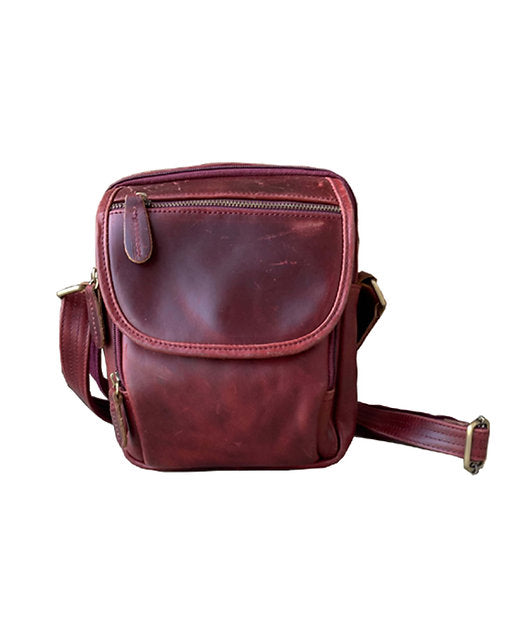 Wine leather crossbody bag on a white background