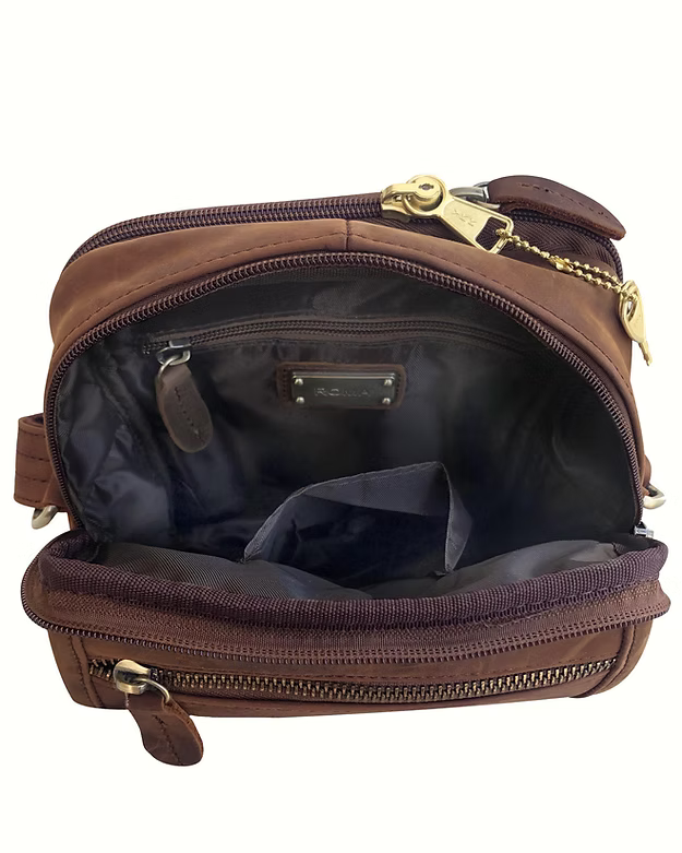 Brown leather bag with gold zippers on a white background