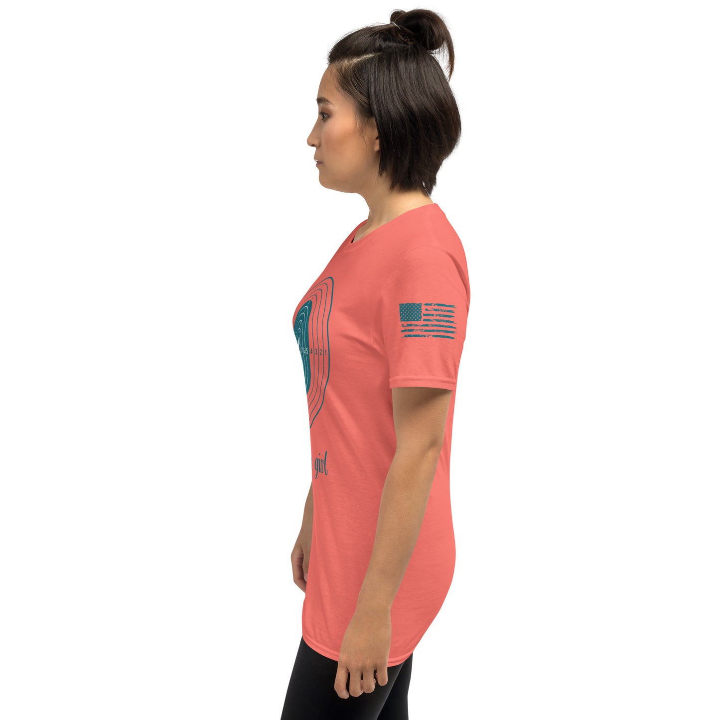 Woman wearing a coral t-shirt with graphics on sleeves against a white background
