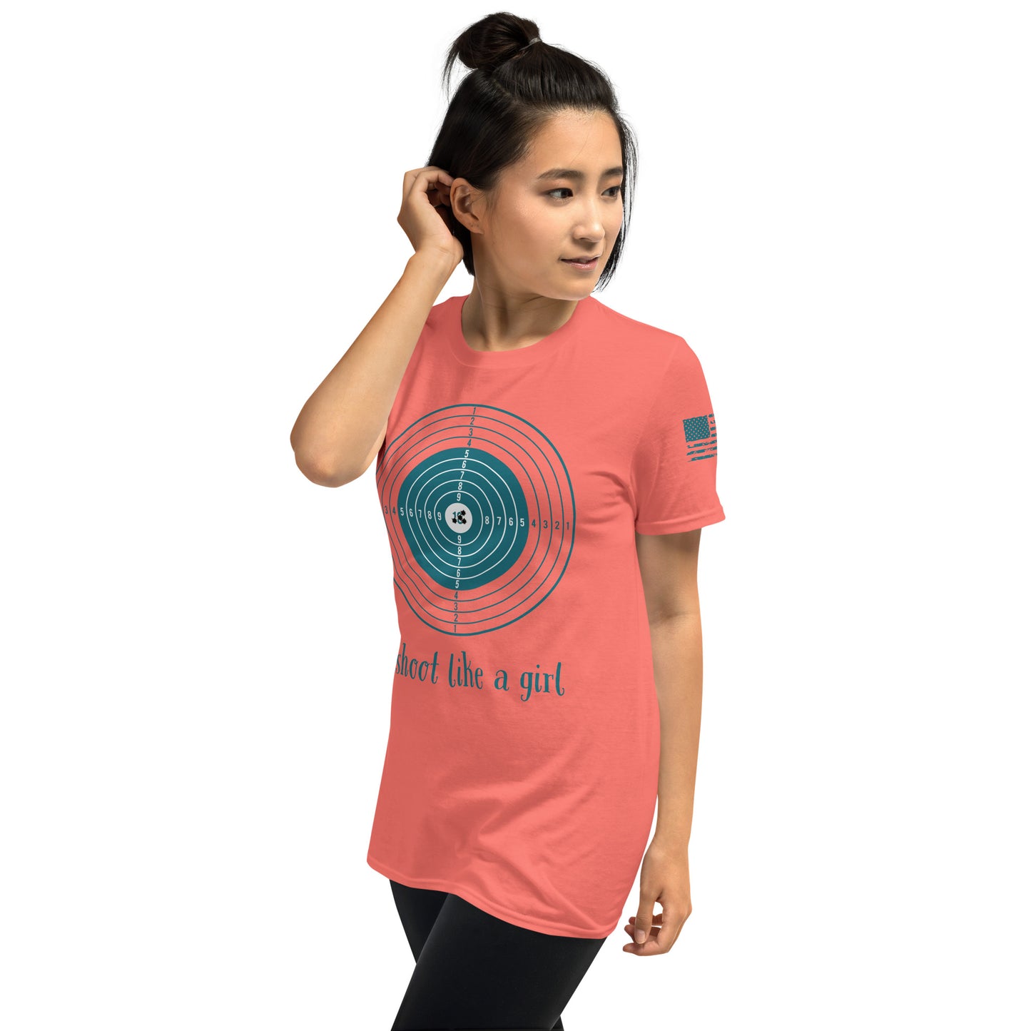 Woman wearing a coral t-shirt with a graphic design and text on a white background