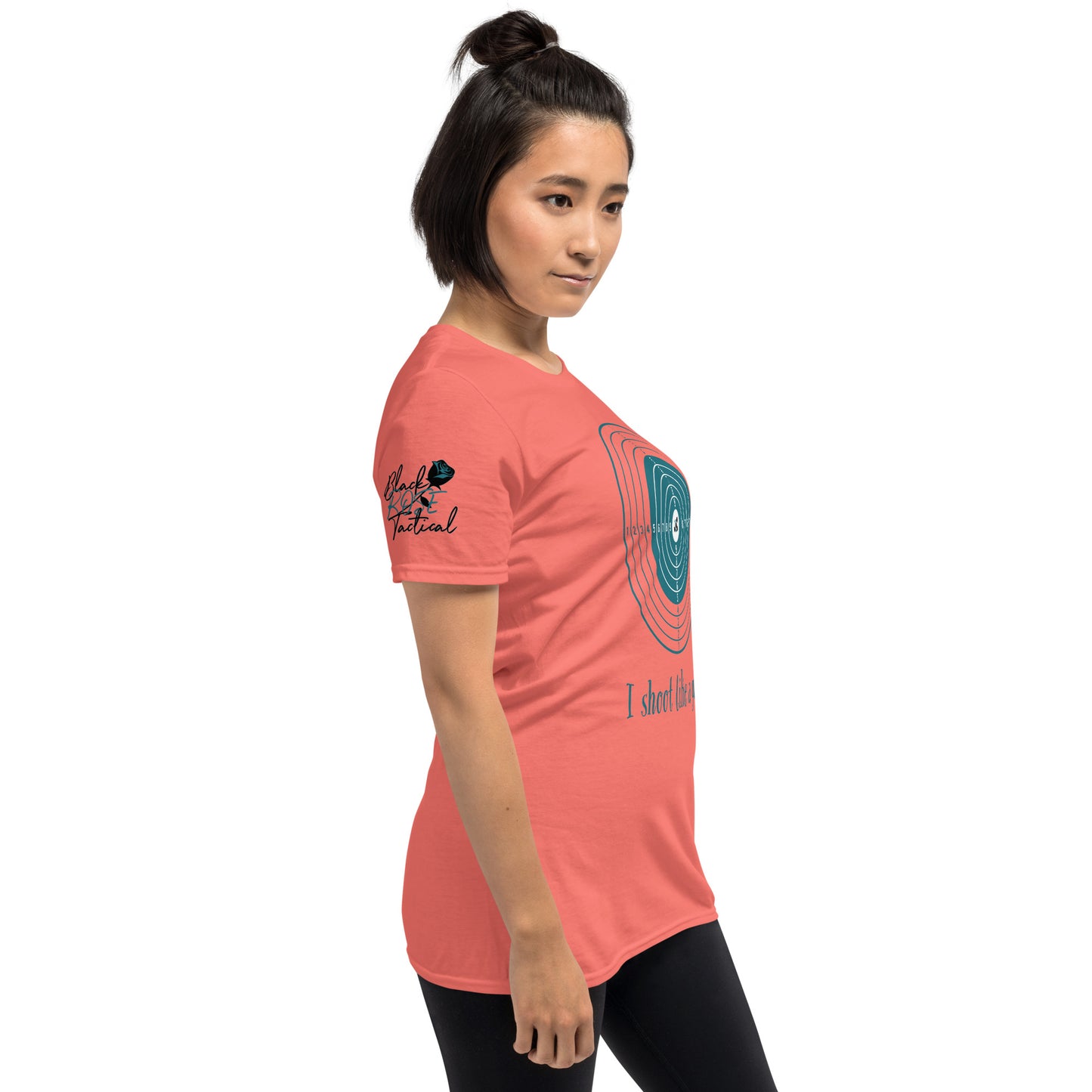 Woman wearing a coral t-shirt with graphics and text on a white background