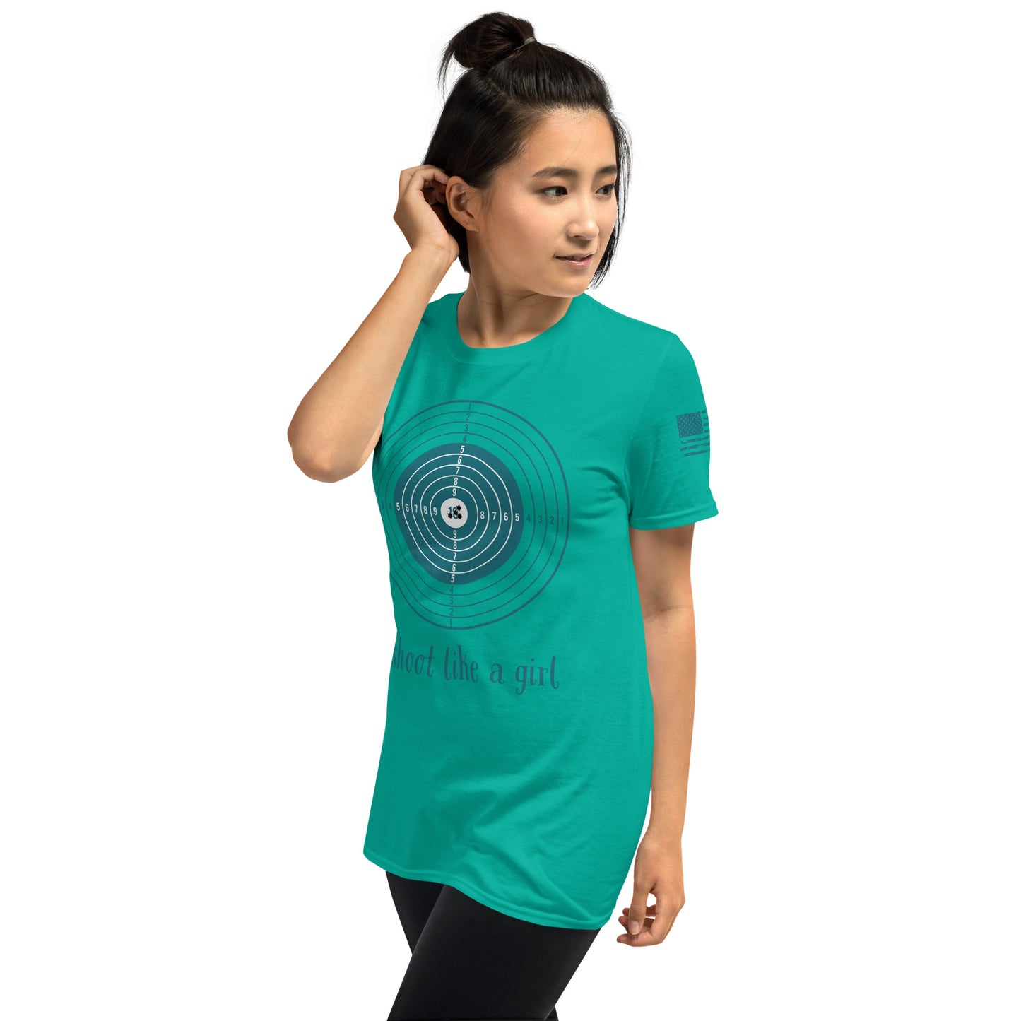 Person wearing a teal t-shirt with a circular design and text on a white background