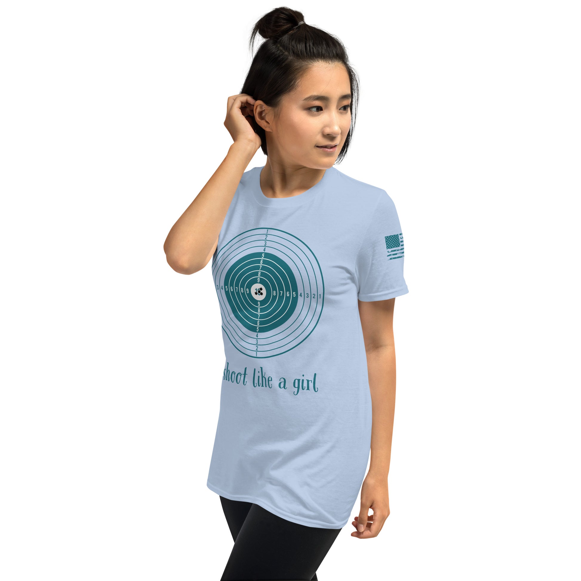 Woman wearing a light blue t-shirt with a graphic design and text on a white background