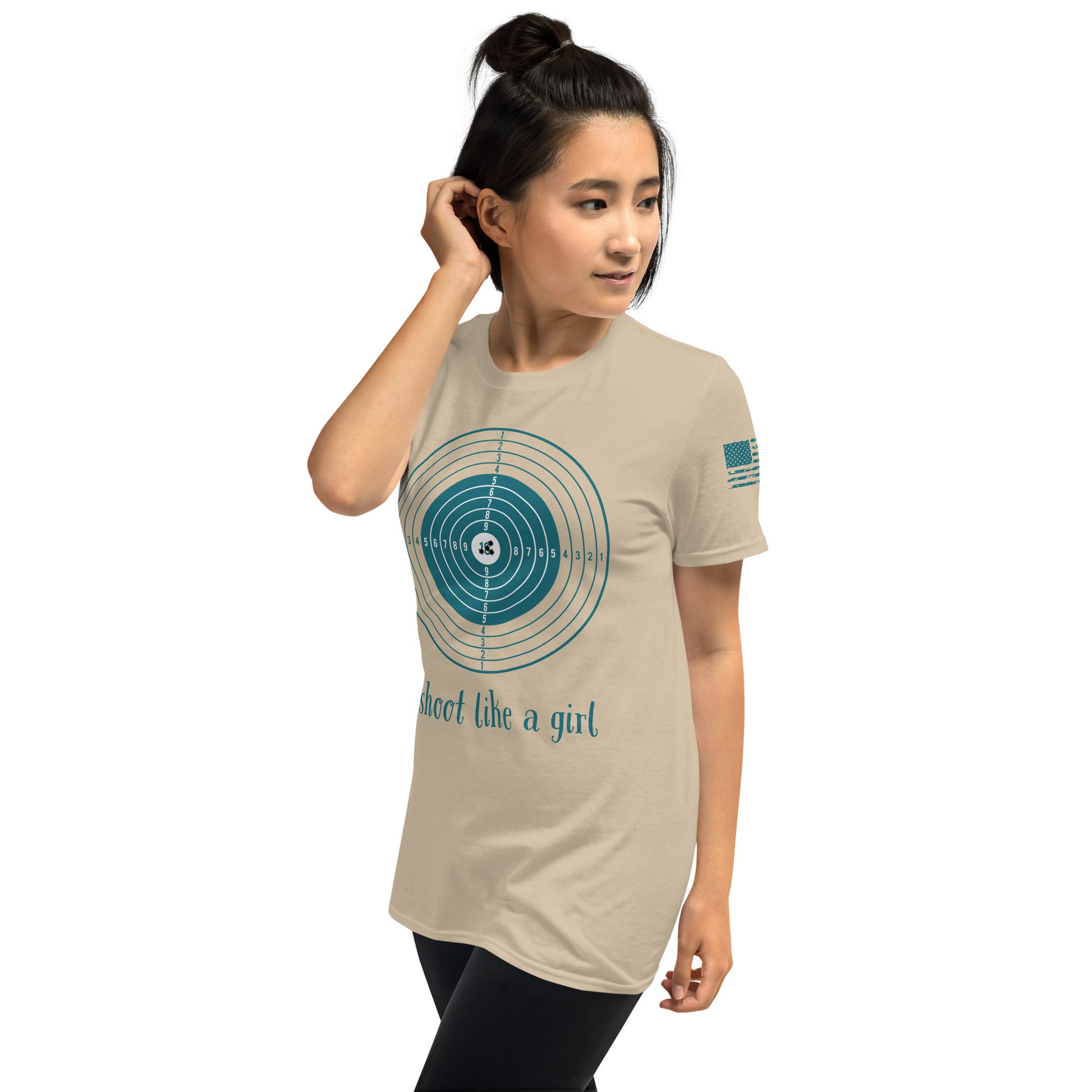 Woman wearing a beige t-shirt with a graphic design and text on a white background