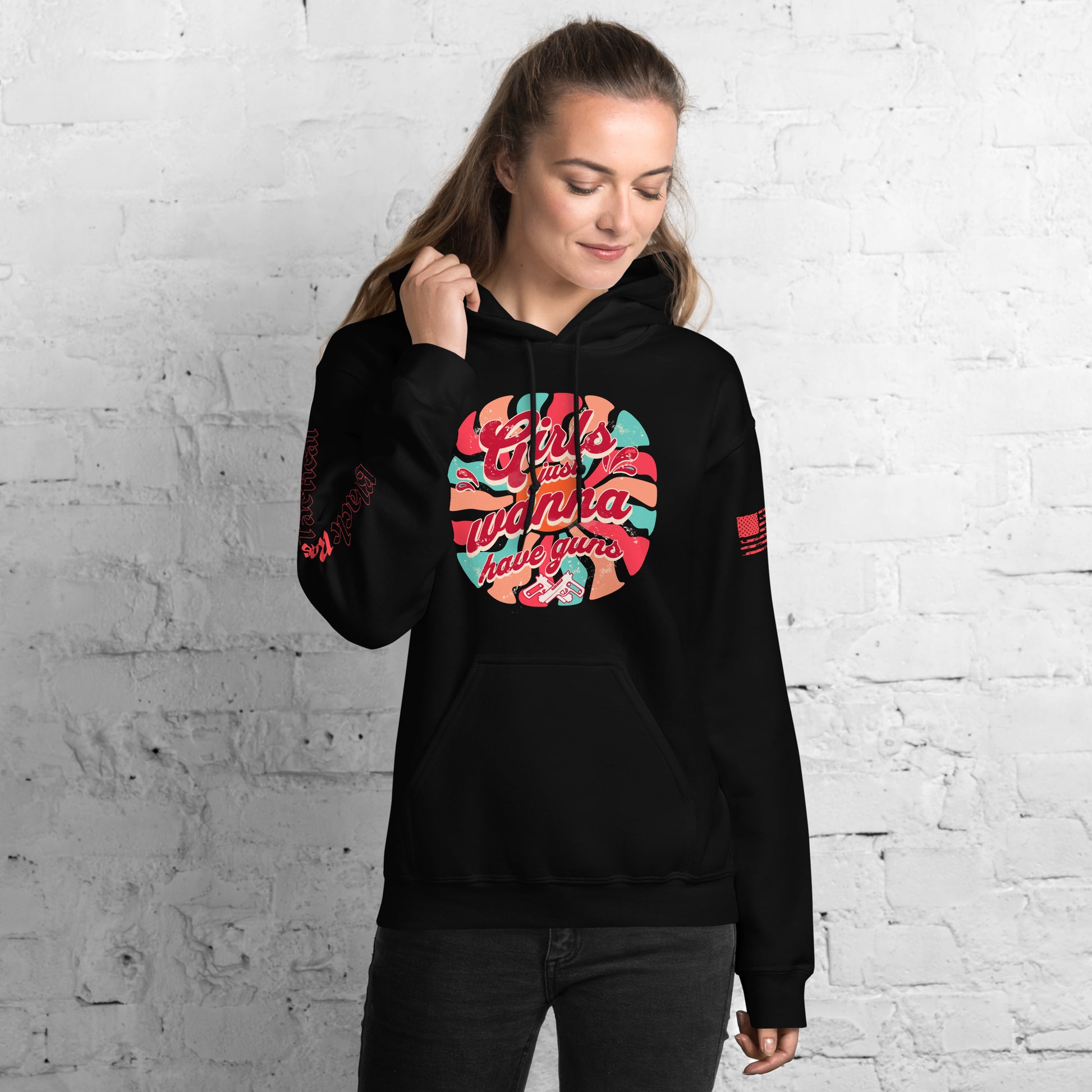 Gun enthusiast wearing Girls Just Wanna Have Guns hoodie outdoors
