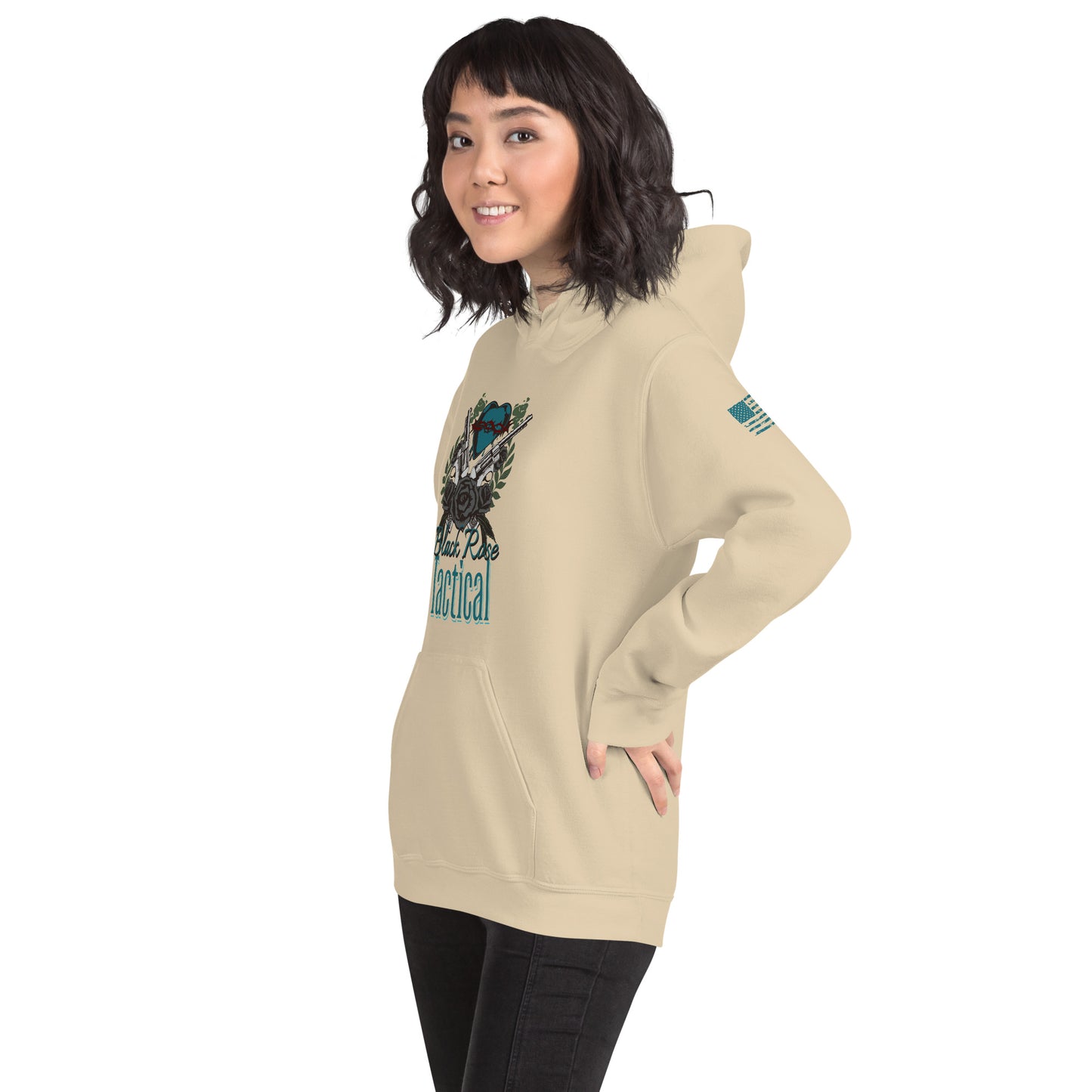 Woman wearing a beige hoodie with graphic design on a white background