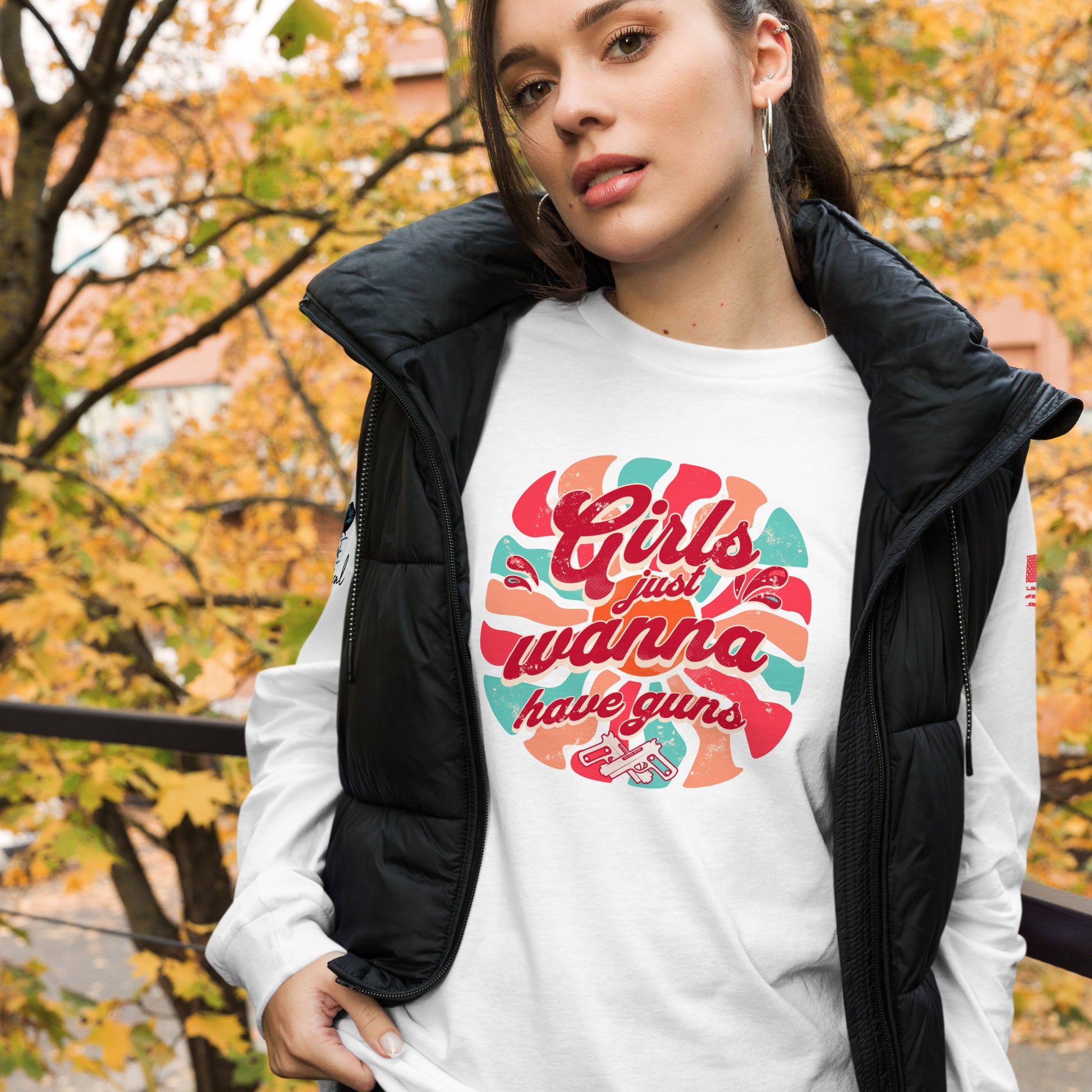 Woman wearing Girls Wanna Have Guns long sleeve tee outdoors, showing 2A pride