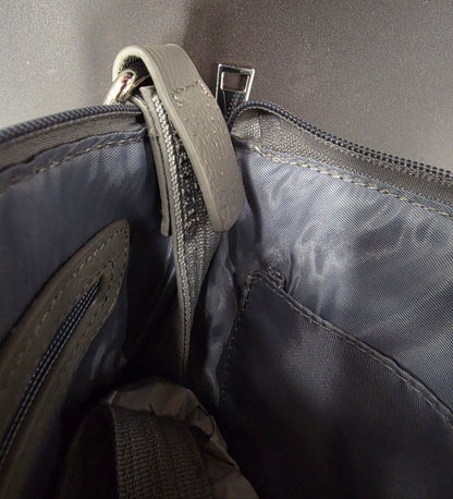 inside of purse showing stitching has come undone
