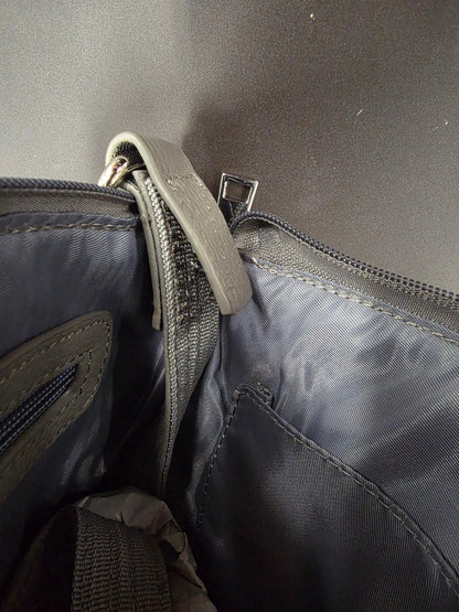 purse strap showing stitching has come undone