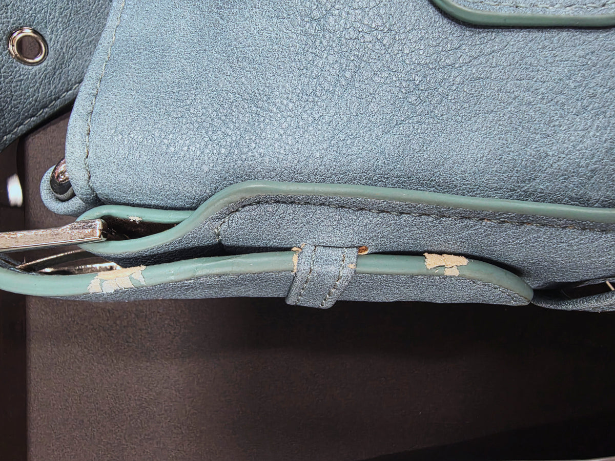 material worn off on purse strap