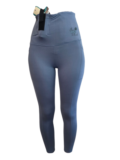 Blue leggings with a black waistband on a white background