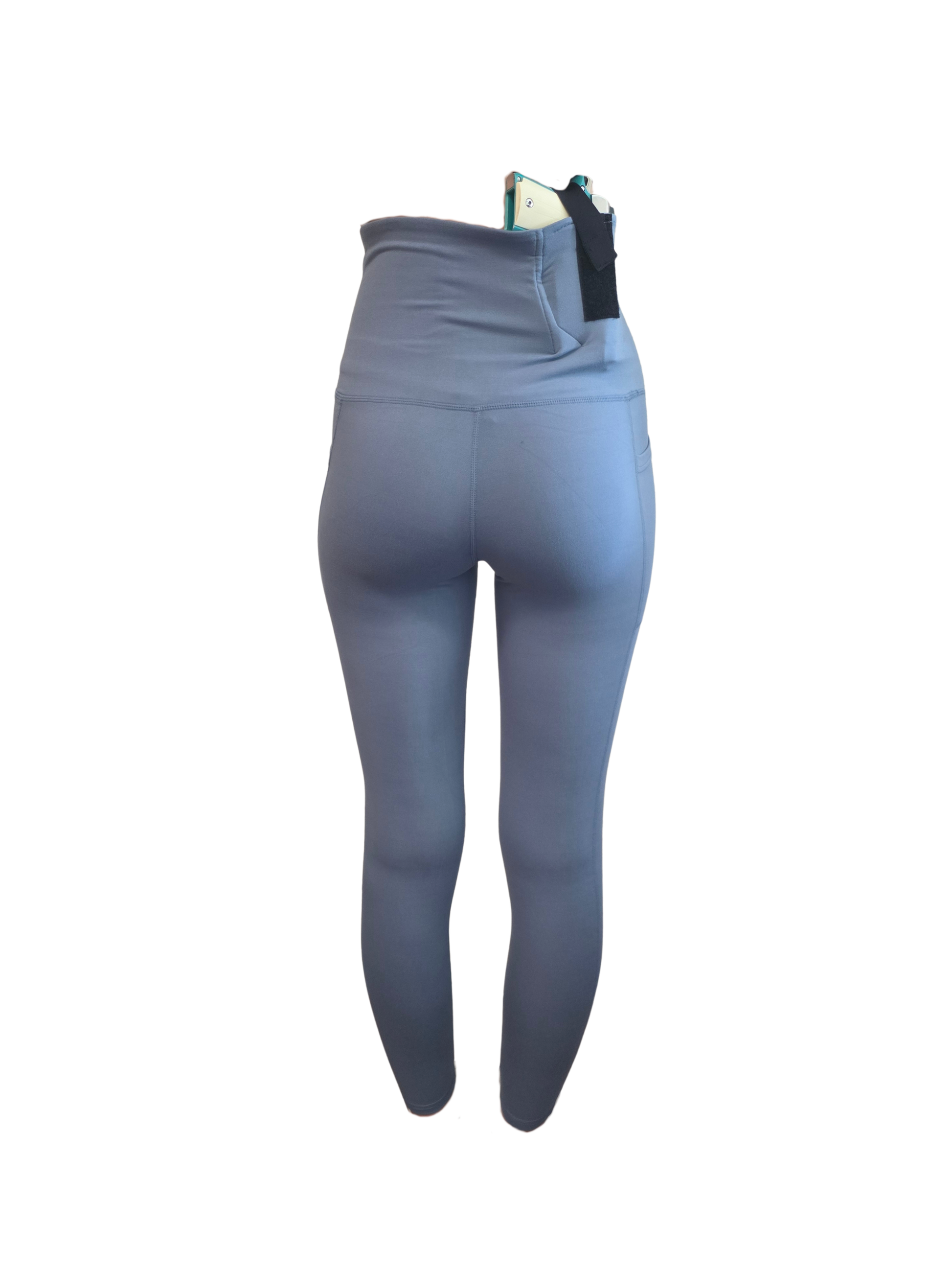 Blue leggings with a black waistband on a white background
