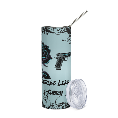 Tumbler with gun and rose design on a light blue background