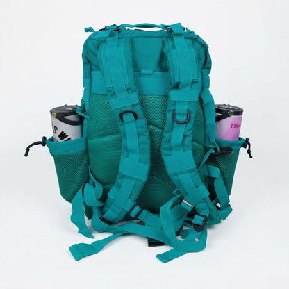 A teal green tactical backpack shown from the back, featuring padded shoulder straps, mesh back panels, side mesh pockets holding two insulated tumblers, and adjustable webbing straps, photographed against a plain white background.