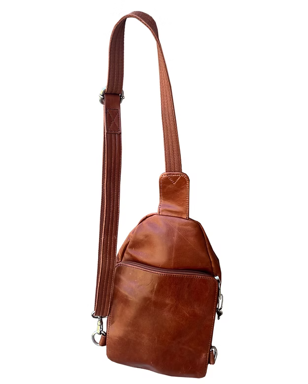 Brown leather sling bag on a white background