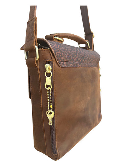 Brown leather bag with gold zipper pull on a white background