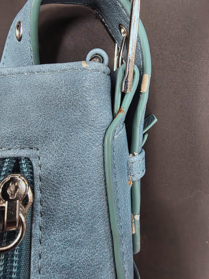 right purse strap showing damage
