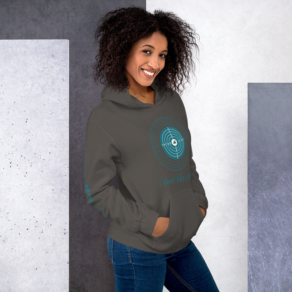 Confident woman outdoors in I Shoot Like a Girl hoodie.