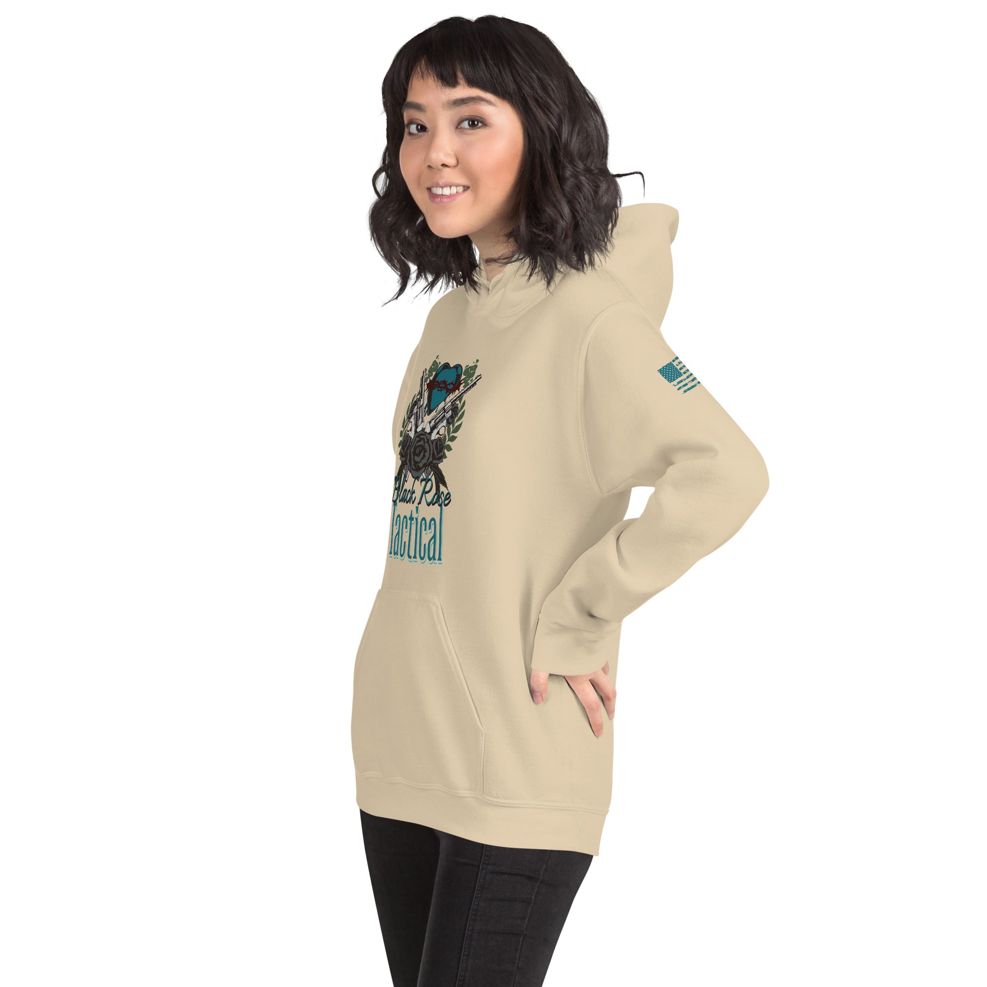 Woman wearing a beige hoodie with graphic design on a white background